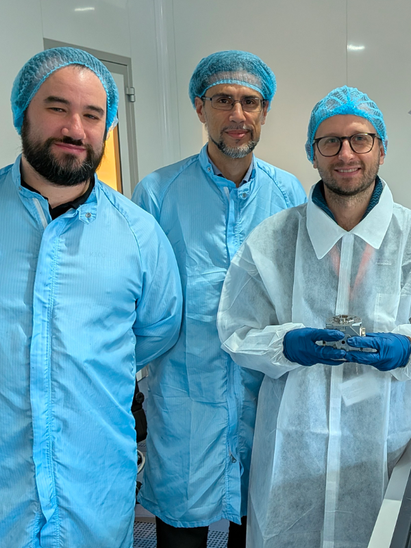 The engineering model of the electrode housing developed for ESA's LISA space mission with Riccardo Freddi and Andrea Moroni (OHB Italia) and Carlo Zanoni (INFN-TIFPA), from right to left.