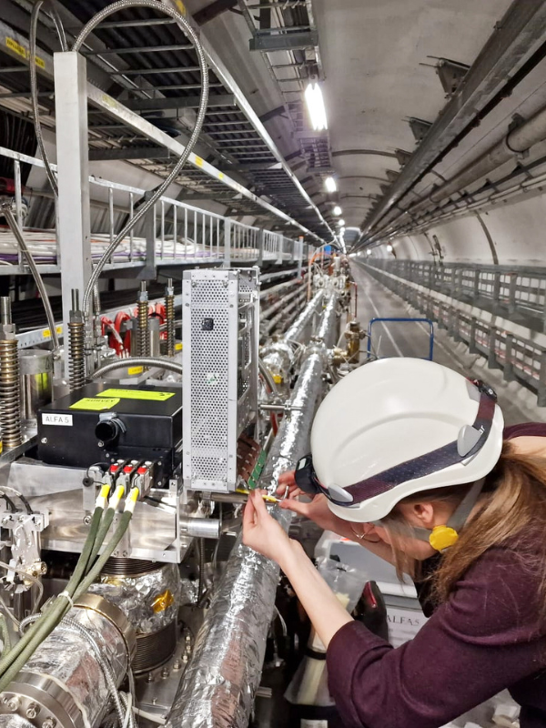 A researcher working on the TWOCRYST detector in the LHC tunnel. ©Sune Jakobsen